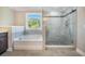 The primary bath includes a soaking tub and glass enclosed shower at 1489 Brockenfelt Dr, Charleston, SC 29414