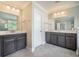 A bathroom featuring a double vanity with a door leading to another room at 1489 Brockenfelt Dr, Charleston, SC 29414
