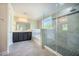 A primary bathroom features a glass enclosed shower, separate soaking tub, and a double vanity at 1489 Brockenfelt Dr, Charleston, SC 29414