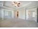 A spacious bedroom with an open doorway to a walk-in closet and other rooms in the home at 1489 Brockenfelt Dr, Charleston, SC 29414