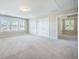 Spacious bonus room offers multiple windows, plush carpet, and ample natural light at 1489 Brockenfelt Dr, Charleston, SC 29414