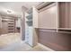 A closet with wood shelving and mauve-colored walls offers plenty of room for organization at 1489 Brockenfelt Dr, Charleston, SC 29414