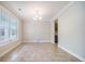 Dining room with tile flooring, neutral paint and a chandelier at 1489 Brockenfelt Dr, Charleston, SC 29414