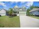 Inviting two-story home with a charming facade, manicured lawn, and spacious driveway at 1489 Brockenfelt Dr, Charleston, SC 29414