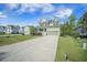 Traditional two-story home with a concrete driveway and manicured lawn at 1489 Brockenfelt Dr, Charleston, SC 29414