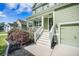 Inviting front porch with white railings and freshly landscaped garden beds at 1489 Brockenfelt Dr, Charleston, SC 29414