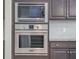 Modern stainless steel microwave and oven appliances, complemented by sleek kitchen cabinets and backsplash at 1489 Brockenfelt Dr, Charleston, SC 29414