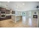 Open kitchen featuring an island, stainless appliances and a fireplace at 1489 Brockenfelt Dr, Charleston, SC 29414