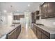 This kitchen features dark cabinets, granite countertops, stainless steel appliances, and an island at 1489 Brockenfelt Dr, Charleston, SC 29414