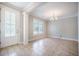 Open-concept living room featuring tile flooring and a chandelier at 1489 Brockenfelt Dr, Charleston, SC 29414