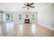 Bright living room features a fireplace and sliding glass doors leading to a porch at 1489 Brockenfelt Dr, Charleston, SC 29414