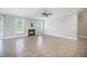 Spacious living room featuring tile flooring, a fireplace, and a ceiling fan for added comfort at 1489 Brockenfelt Dr, Charleston, SC 29414