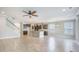 Open concept kitchen and living area with island, modern cabinetry, and tiled floors at 1489 Brockenfelt Dr, Charleston, SC 29414