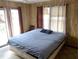 Bedroom showcasing a comfortable bed, curtains, and carpeted flooring at 1603 Lybrand St, Edisto Island, SC 29438