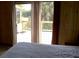 Cozy bedroom featuring a walkout porch and wood-paneled walls at 1603 Lybrand St, Edisto Island, SC 29438