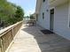 Wooden deck on the side of the house offering additional outdoor space with a table at 1603 Lybrand St, Edisto Island, SC 29438