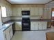 Efficient kitchen with modern appliances and ample counter space, perfect for cooking at 1603 Lybrand St, Edisto Island, SC 29438