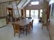 Open-concept living room with dining area and access to the outdoor area at 1603 Lybrand St, Edisto Island, SC 29438