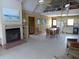 Cozy living room features a fireplace and open layout to the dining and kitchen at 1603 Lybrand St, Edisto Island, SC 29438