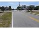 Street view of a coastal community with houses and palm trees at 1603 Lybrand St, Edisto Island, SC 29438