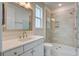Bright bathroom with a glass enclosed shower, a vanity with white cabinets, and modern finishes at 1619 Cultivation Ln, Mount Pleasant, SC 29466