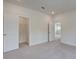 Spacious bedroom with neutral carpet, adjacent closet, and bright, open feel at 1619 Cultivation Ln, Mount Pleasant, SC 29466