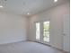 Bright bedroom featuring plush carpeting and access to a private balcony at 1619 Cultivation Ln, Mount Pleasant, SC 29466