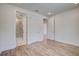 Bedroom with hardwood flooring, white trim, and doorways to the bathroom and hallway at 1619 Cultivation Ln, Mount Pleasant, SC 29466