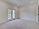 Bright and open bedroom with a private balcony and plush carpeting for added comfort at 1619 Cultivation Ln, Mount Pleasant, SC 29466