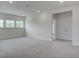 Large bonus room with neutral carpet, multiple windows, and natural light at 1619 Cultivation Ln, Mount Pleasant, SC 29466