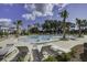 A large community pool surrounded by mature trees and loungers perfect for relaxation at 1619 Cultivation Ln, Mount Pleasant, SC 29466
