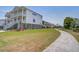 Stylish home with a charming pathway and manicured lawn at 1619 Cultivation Ln, Mount Pleasant, SC 29466