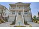 Charming two-story home with double porches, a well-manicured lawn, and classic architectural details at 1619 Cultivation Ln, Mount Pleasant, SC 29466