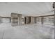 Spacious garage with finished concrete floors and modern louvered window shutters offers ample parking at 1619 Cultivation Ln, Mount Pleasant, SC 29466