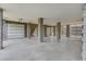 Spacious garage area featuring high ceilings and multiple garage doors at 1619 Cultivation Ln, Mount Pleasant, SC 29466