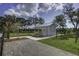 Charming white gazebo nestled in a lush green space with trees, offering a serene retreat at 1619 Cultivation Ln, Mount Pleasant, SC 29466