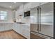 Well-lit kitchen featuring stainless steel appliances, gas cooktop, and ample white cabinetry at 1619 Cultivation Ln, Mount Pleasant, SC 29466