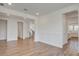 Spacious living room with hardwood floors, white trim, and an open floor plan at 1619 Cultivation Ln, Mount Pleasant, SC 29466