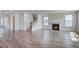 Spacious living area with wood floors, a fireplace, and stairs leading to the second floor at 1619 Cultivation Ln, Mount Pleasant, SC 29466