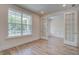 Bright office space with hardwood flooring, large window, and glass French doors at 1619 Cultivation Ln, Mount Pleasant, SC 29466