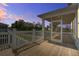 Relaxing screened porch with wooden floors, ideal for enjoying the outdoors in comfort and style at 1619 Cultivation Ln, Mount Pleasant, SC 29466