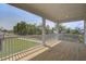 Spacious covered back porch with a view of a grassy yard and neighborhood homes at 1619 Cultivation Ln, Mount Pleasant, SC 29466