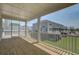 Covered outdoor porch with screened-in enclosure overlooking a residential neighborhood at 1619 Cultivation Ln, Mount Pleasant, SC 29466