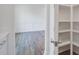 Room featuring white walls, dark wood flooring, and walk-in pantry at 1619 Cultivation Ln, Mount Pleasant, SC 29466