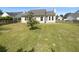 View of the backyard featuring a well-maintained lawn, fence, and patio at 1622 Pin Oak Cut, Mount Pleasant, SC 29466