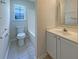 Bathroom with a sink, mirror, toilet and shower/bath combo at 1622 Pin Oak Cut, Mount Pleasant, SC 29466