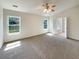 Inviting bedroom featuring a ceiling fan, plush carpet, and two windows for natural light at 1622 Pin Oak Cut, Mount Pleasant, SC 29466