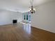 Bright and airy living room with hardwood floors, fireplace, and large windows offering ample natural light at 1622 Pin Oak Cut, Mount Pleasant, SC 29466