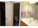 A well-lit bathroom with a sink, vanity, mirror and separate toilet area creates a relaxing space at 1757 Wayah Dr, Charleston, SC 29414