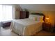 Cozy bedroom featuring a well-made bed, antique dresser and an ambient bedside lamp at 1757 Wayah Dr, Charleston, SC 29414
